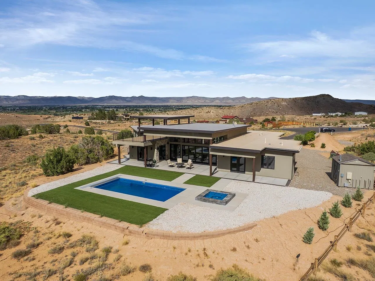 Aerial view of the backyard pool, hot tub and lawn