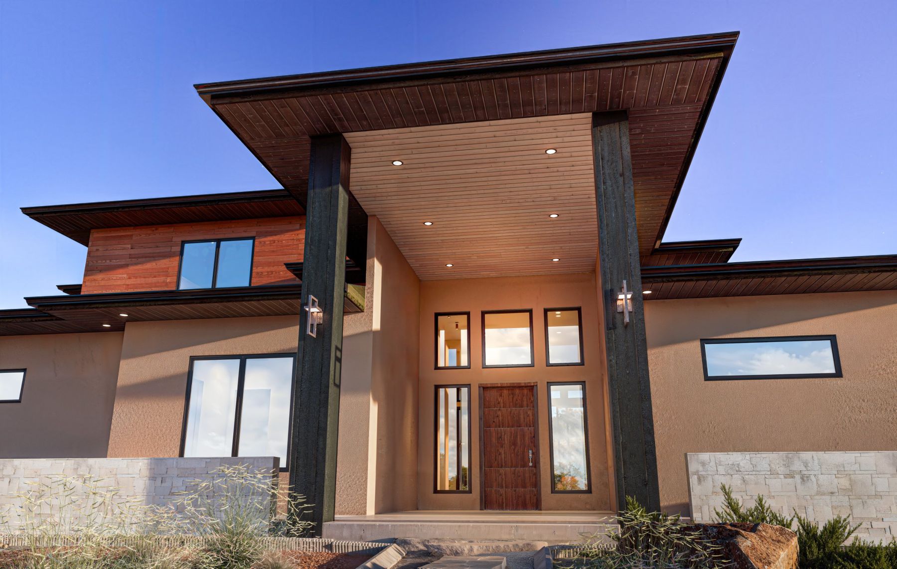 Covered entry with a wood front door and tall windows