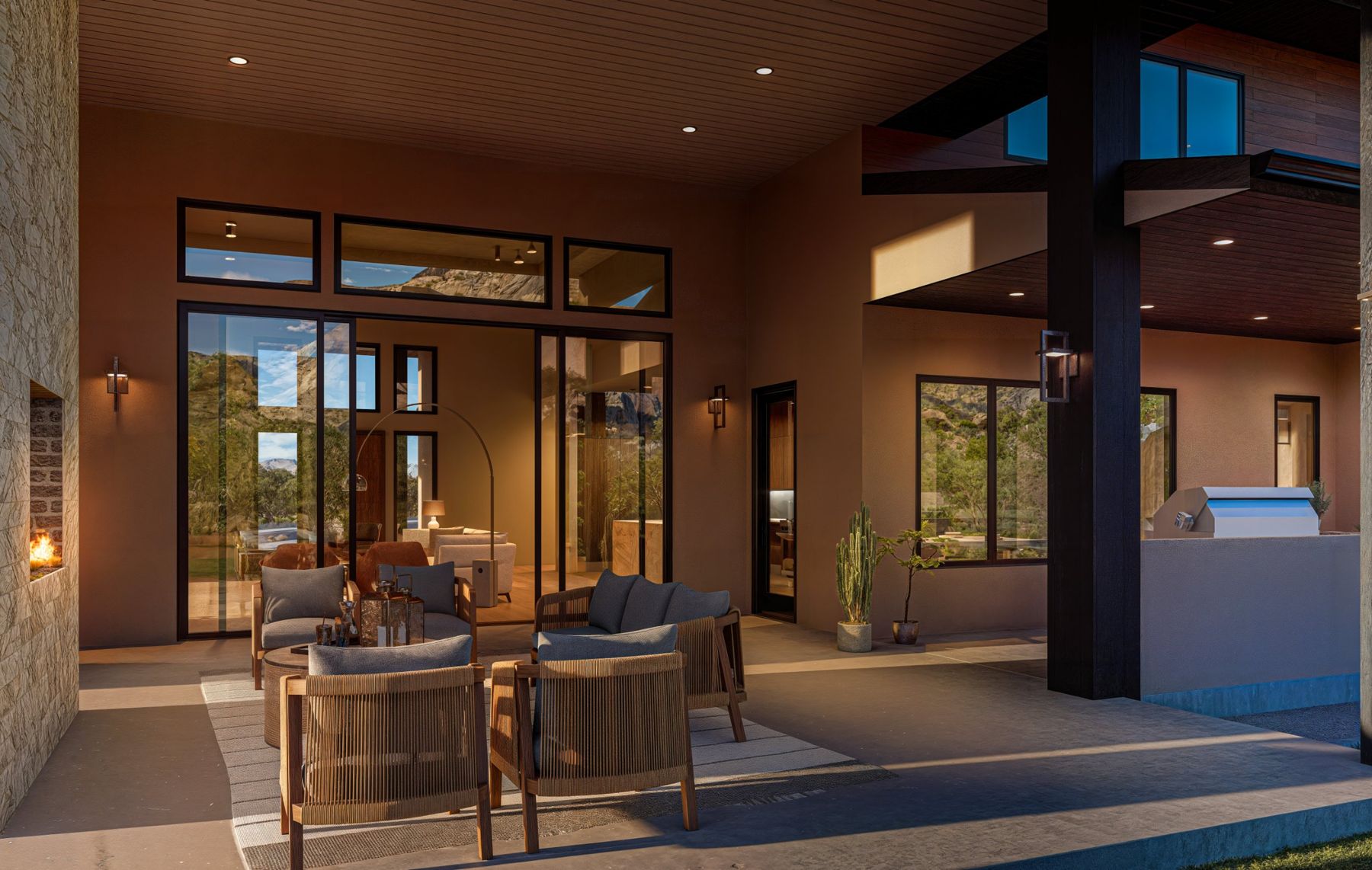 Covered back patio with an outdoor fireplace and seating